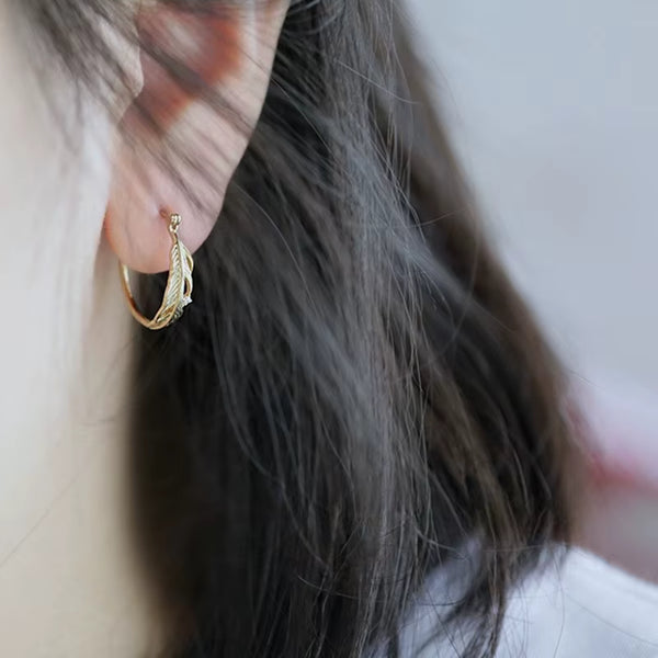 Aretes de Aro con Plumas Huitan